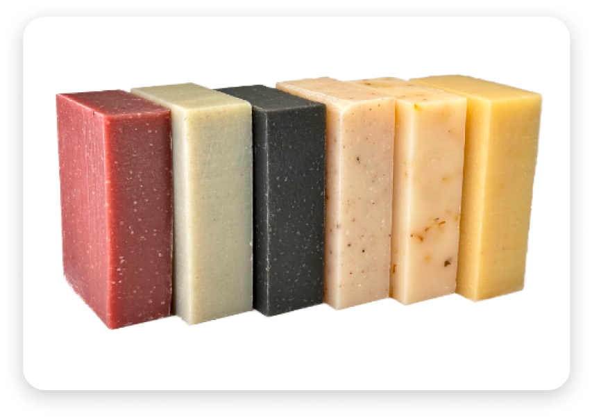 A photo of colorful bars of soap lined up in a group.